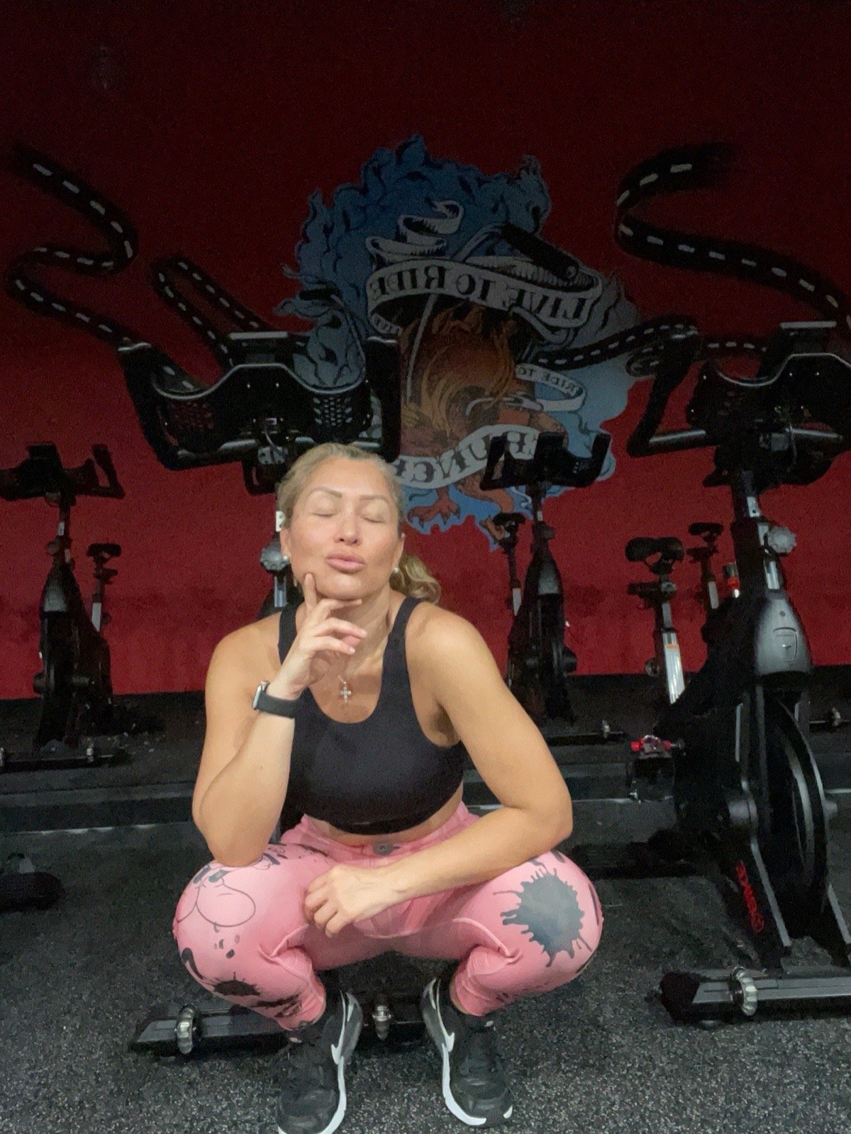 Paoli Rueda smiling after a workout in a spin studio